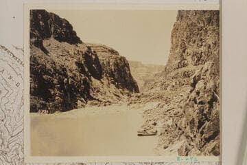 Downstream at the head of Separation Rapid- right bank.  The three boats of the Dusty Dozen appear at lower right