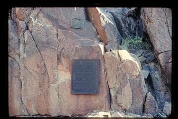 The plaque at Separation Rapid placed first near the edge of the river and removed--1934-1939, and the plaque to replace it which was placed in 1939 by Julius Stone and party.  The first plaque was placed a second time 1971, Nov. 27