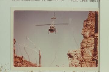 Helicopter leaving Royal Arch Creek carrying the injured Harvey Butchart.  North of Royal Arch Creek