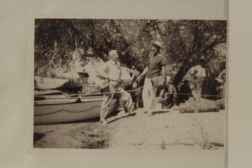 Joe Desloge discusses the prospects with Marston prior to start of 1950 motor run of Grand Canyon.  Lees Ferry