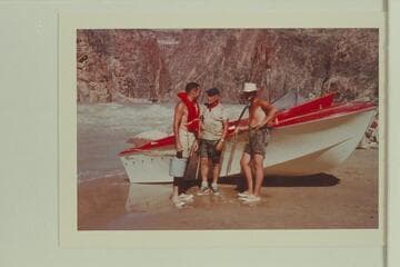 Garth Marston, Ed I'Anson and Jim Bechtel talk over the business of running up Monument Creek Rapid