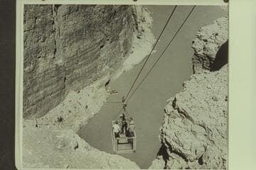 The skip on the lower cable at the upper Marble Canyon damsite.  The near boat is the "Esmeralda II."  The boat next to it is the 19-ft. Chris-Craft "Hudson."