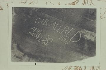 Inscription at lower end of Beaver Bottom in cave of White Rim Formation