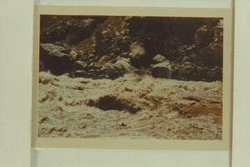 The glass outboard motorboat "Jax" in Vulcan Rapid