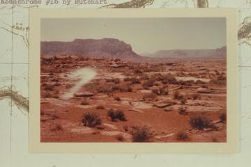 Down Grand Canyon from near Mt. Sinyala.  Yumtheska Point at upper left.  Snow on Mt. Emma in distance