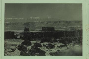 From the rim of Millard Canyon to the Buttes of the Cross and across Bonita Bend to Candlestick Tower.  The Turks Head is at right margin and the LaSal Mountains are in the distance