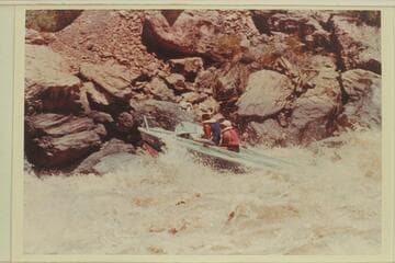 Buzz Belknap piloting the "Bootoo" through Vulcan Rapid.  Dock Marston is the passenger