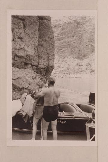 Edi Juan gives Willie Taylor a haircut with the electric razor running off the battery of the boat; mouth of Tapeats Creek