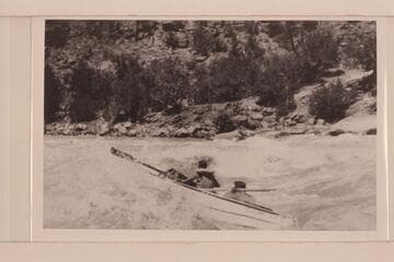 Kent Frost at the oars and Loel Marston as passenger in Upper Disaster Falls