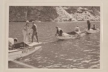 The three Nevills boats and crews at end of Grand Canyon run in 1938.  Lake Mead near Emory [sic] Falls.  Left to right:  Elzada Clover; Norman Nevills; Emery Kolb; Lois Jotter; Lorin Bell; Del Reed; William Gibson