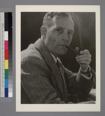 Portrait of Edwin Powell Hubble, smoking a pipe