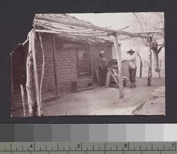 Unidentified natives using grinder