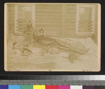 2 children with dog sled and dogs