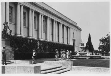 Library building with guard and visitors, circa 1930