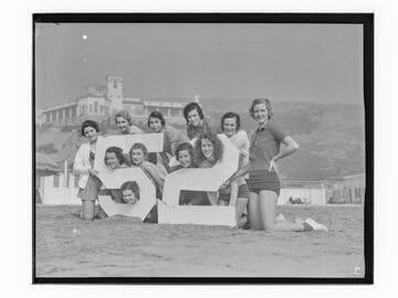 Group of women with number 52 sign at the Bel-Air Bay club, Santa Monica
