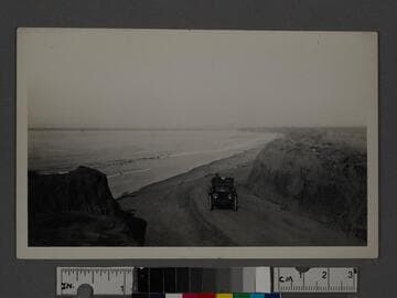 Solitary car on beach road