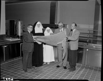 Men reviewing plans in St