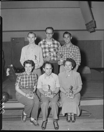 Six person bowling team with trophies