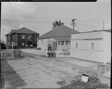 View of house and double garage from back yard