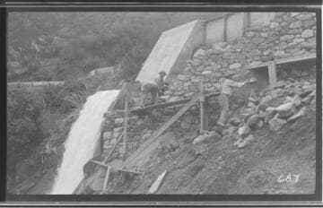 Several men making repairs to the ditch at Kaweah #3 Hydro Plant