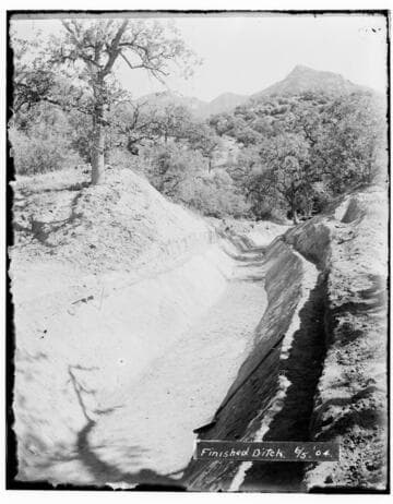 A finished ditch at Kaweah #2 Hydro Plant showing the mountains in the background