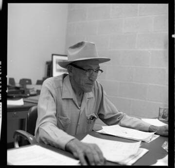 Hydro Generation Supervisor E. I. Bulpitt at his desk