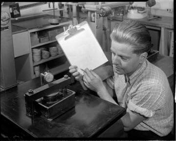 Man compressing material in test