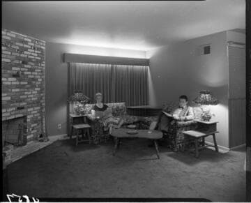 Husband and wife in seated in living room (same couple as in image #54843)