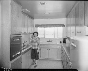 Woman in her electric kitchen