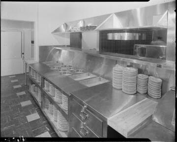 Restaurant food prep area with dishes and storage