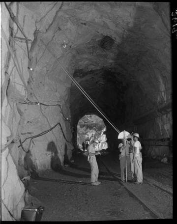 Engineers (Hayes) taking measurements inside Big Creek 4's powertunnel
