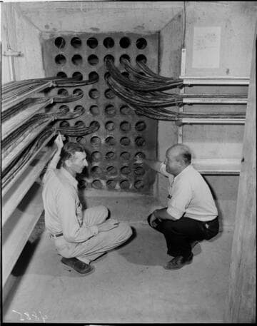 Two men in an underground vault