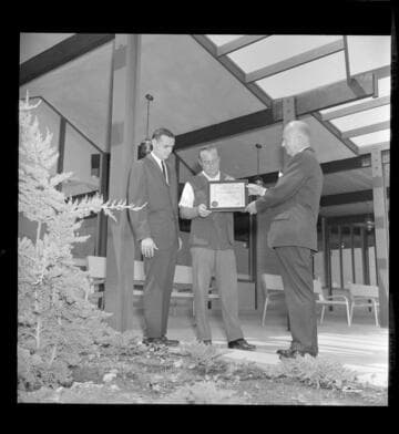 Home owner receiveing All Electric Building Award