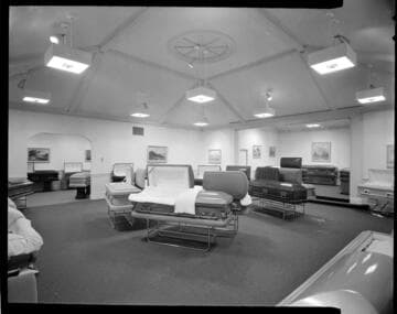 Coffins on display in a mortuary showroom