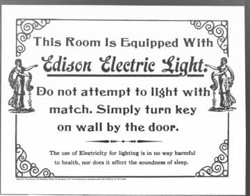 Sign stating the following: This Room Is Equipped with Edison Electric Light. Do not attempt to light with match. Simply turn key on wall by door