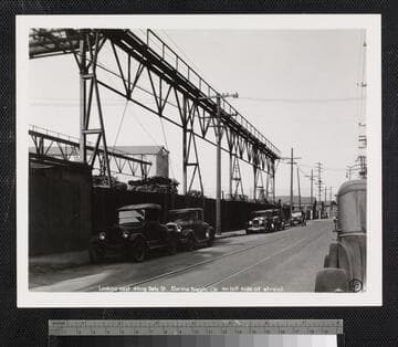 Looking east along Date St. Eureka Supply Co. on left side of street