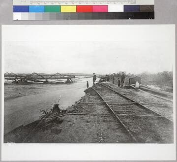 Downey Ave. Bridge (now Broadway) in flood of 1885