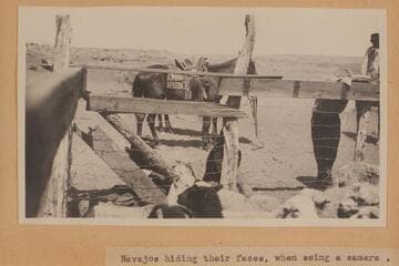 "Navajos hiding their faces, when seeing a camera."