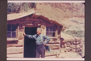 Bert Loper at his cabin at Red Canyon