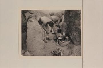 Breakfast at camp at Mile 19; right bank.  Marston stands left and Ed Hudson and Willie Taylor dish up some mix of concentrates