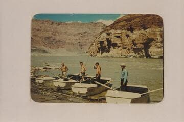 Four boatmen of Nevills San Juan party landing below Paria Riffle at end of run on San Juan River:  Nevills, Wing, Reilly and Wright