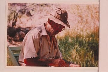 Dock Marston writing up the log; Phantom Ranch