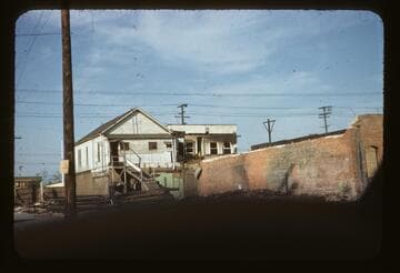 In back of burnt out building