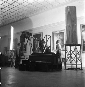 Staff photographing paintings in the portrait gallery in the Huntington residence