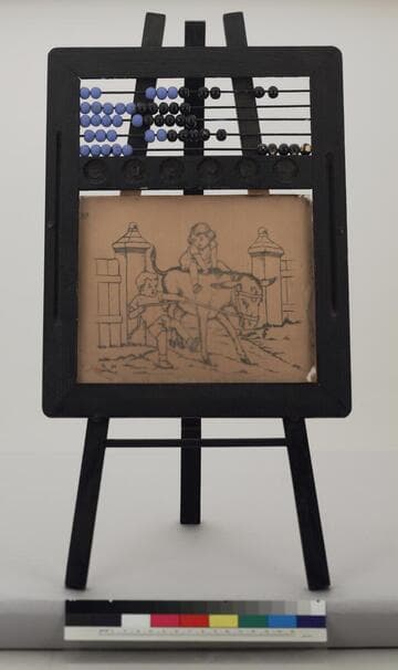 Glass drawing slate contained within a wooden easel, circa 1900