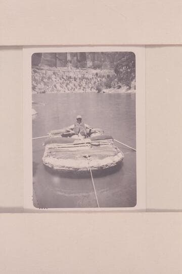 William J. Davis in the neoprene raft used for a run of the Yampa River and upper Green River in 1951, June.  55-lb. raft which weighed 75 lbs. when rigged as shown