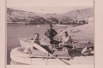 Amos Burg; Willis Johnson; and Buzz Holmstrom with the two boats upon their arrival at Lake Mead