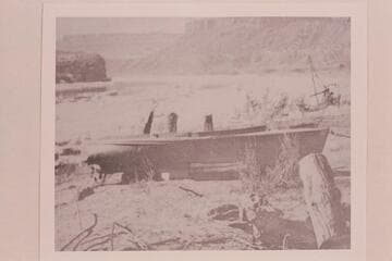 Small motorboat on the beach above the Spencer placer operations at Lees Ferry