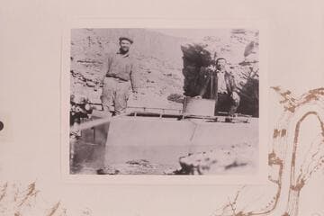 Neil Johnson and Andy Samsky in outboard motorboat "Mallard."  The motorboat was 18 ft. long and powered by a 21 HP Johnson outboard motor.  Mile 98.2--98.3 in Glen Canyon
