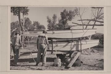 A. K. Reynolds and Lug Larsen prepare for launching of the boats at Carrs Landing in Brown's Hole